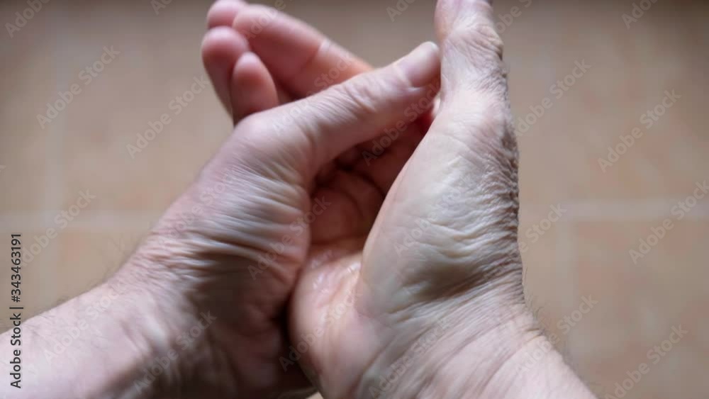 man cleans his hands with disinfectant gel man cleans his hands with disinfectant gel
