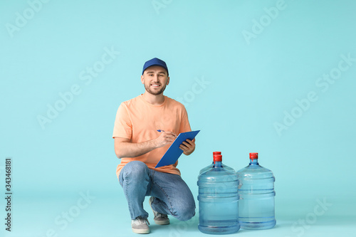 Delivery man with bottles o...
