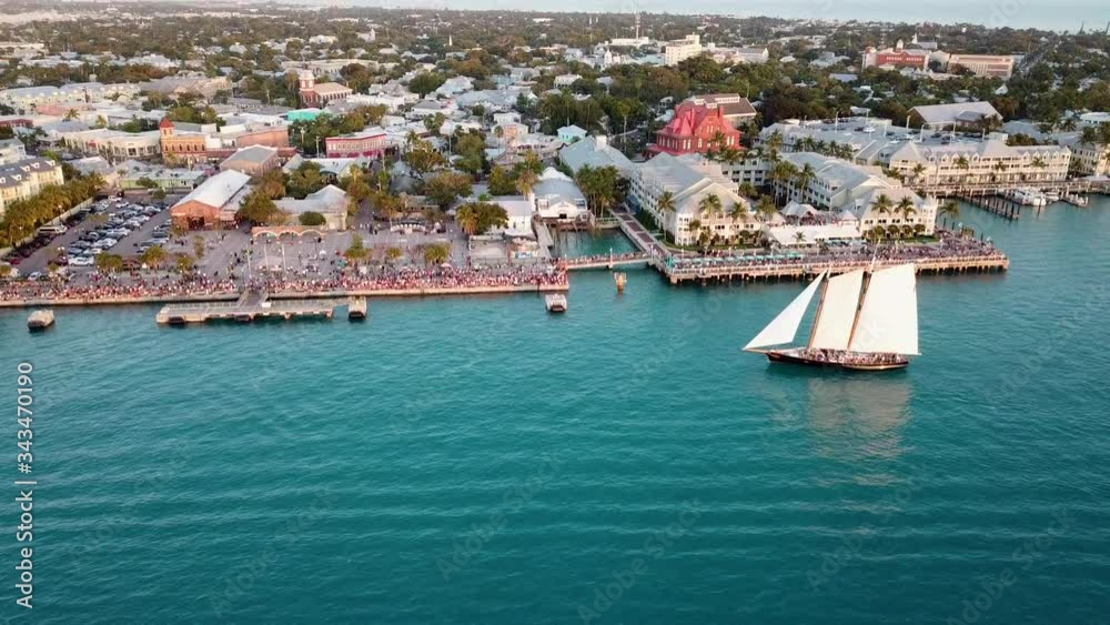 Beautiful 4K aerial drone shot panning up to Mallory Square in Key West, Florida during sunset Beautiful 4K aerial drone shot panning up to Mallory Square in Key West, Florida during sunset