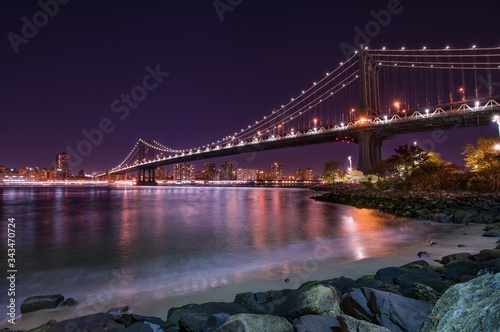 Valokuva Illuminated Manhattan Bridge Over East River Against Clear Sky At Night