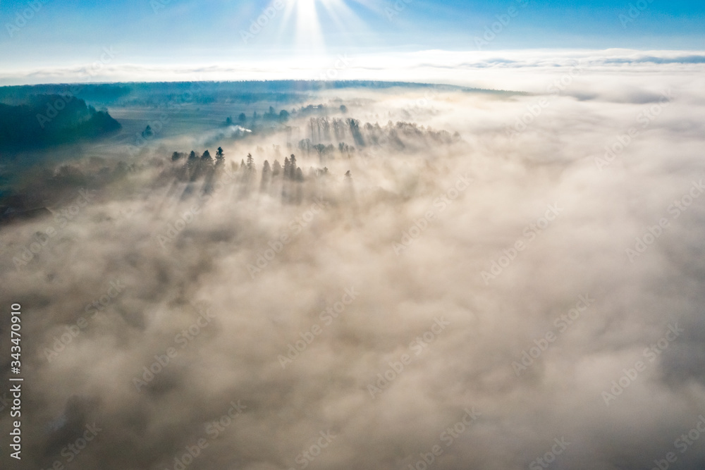 Foggy winter morning in mountain village with top view