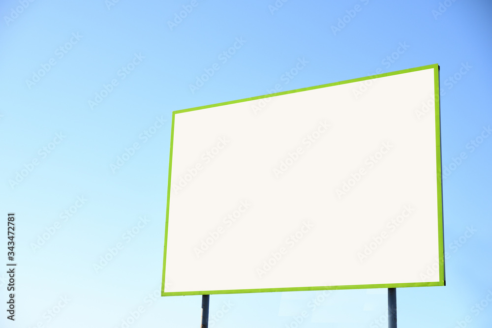 Blank billboard against blue sky, put your own text here Blank billboard against blue sky, put your own text here