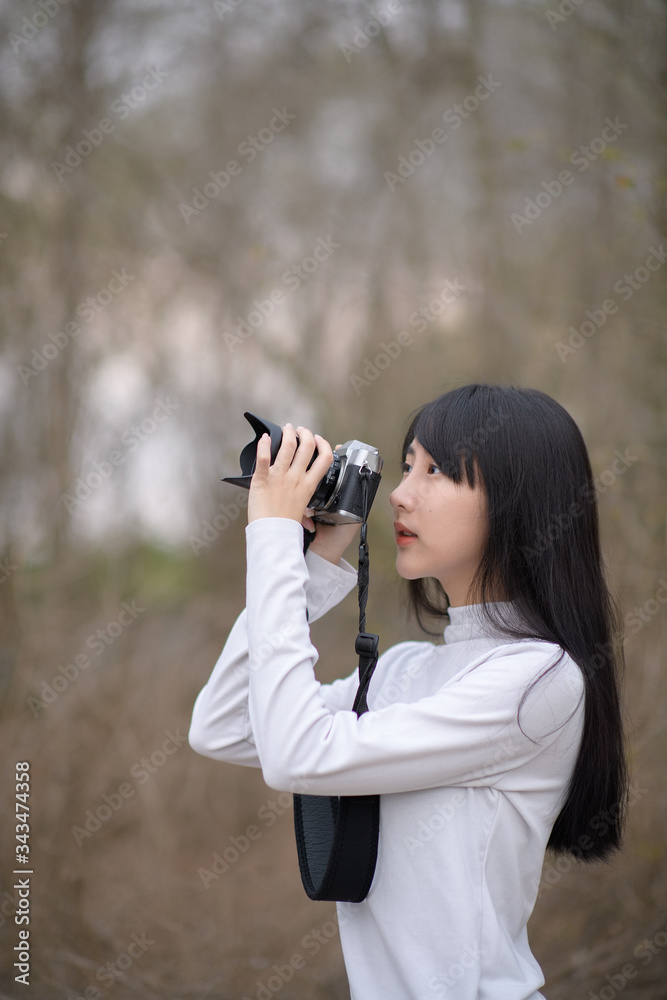 Portraif of  professional photographer.holding camera in hand outdoor free from copy space. Photography working in action.