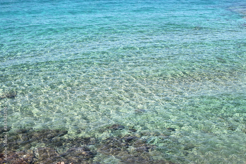 Obraz premium Calm clean, ultramarine water surface with little waves 