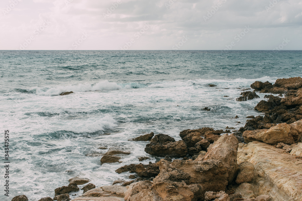 coastline of mediterranean sea against sky with clouds in cyprus coastline of mediterranean sea against sky with clouds in cyprus