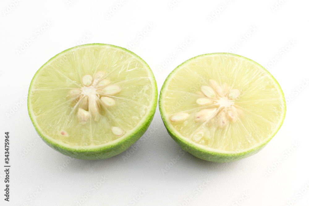 Juicy slice of lime isolated on white background Juicy slice of lime isolated on white background