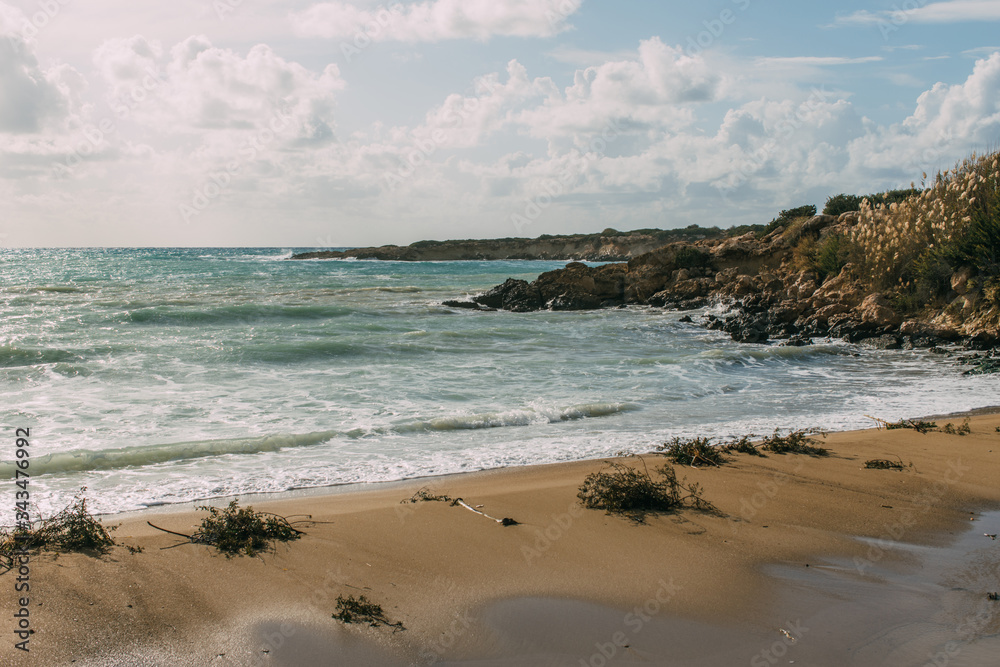 wet and sandy beach near mediterranean sea against blue sky wet and sandy beach near mediterranean sea against blue sky