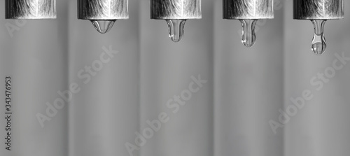 Tableau sur toile Steps of a water dripping from the faucet