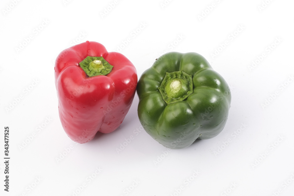 Green and red bell pepper on white background Green and red bell pepper on white background