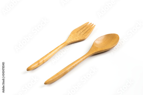 Wooden spoon and fork on white.