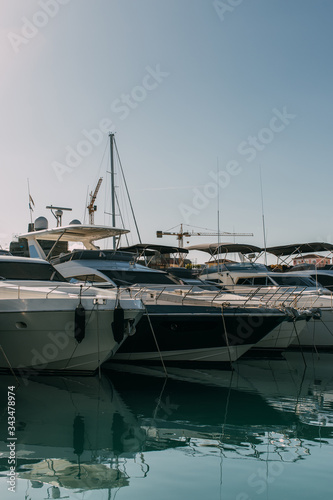 sunshine on docked and modern yachts in mediterranean sea