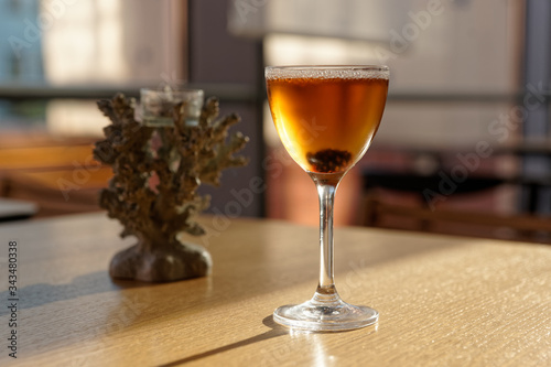 Cocktail with preserved sweet cedar cone