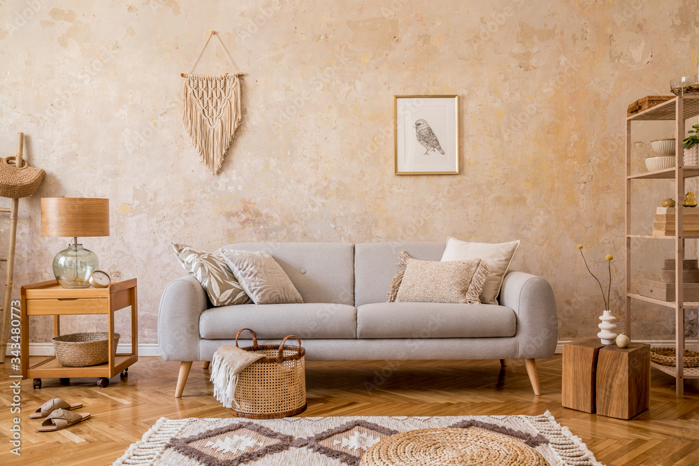 © FollowTheFlow - Stylish scandi compostion at living room interior with design gray sofa, wooden coffee table, shelf, cube, carpet, rattan pouf, plants, picture frame, table lamp and elegant accessories in home decor. © FollowTheFlow - Stylish scandi compostion at living room interior with design gray sofa, wooden coffee table, shelf, cube, carpet, rattan pouf, plants, picture frame, table lamp and elegant accessories in home decor.