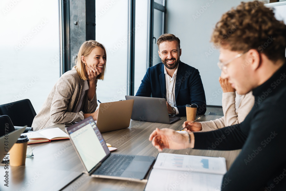 Group of smart motivated businesspeople working together Group of smart motivated businesspeople working together