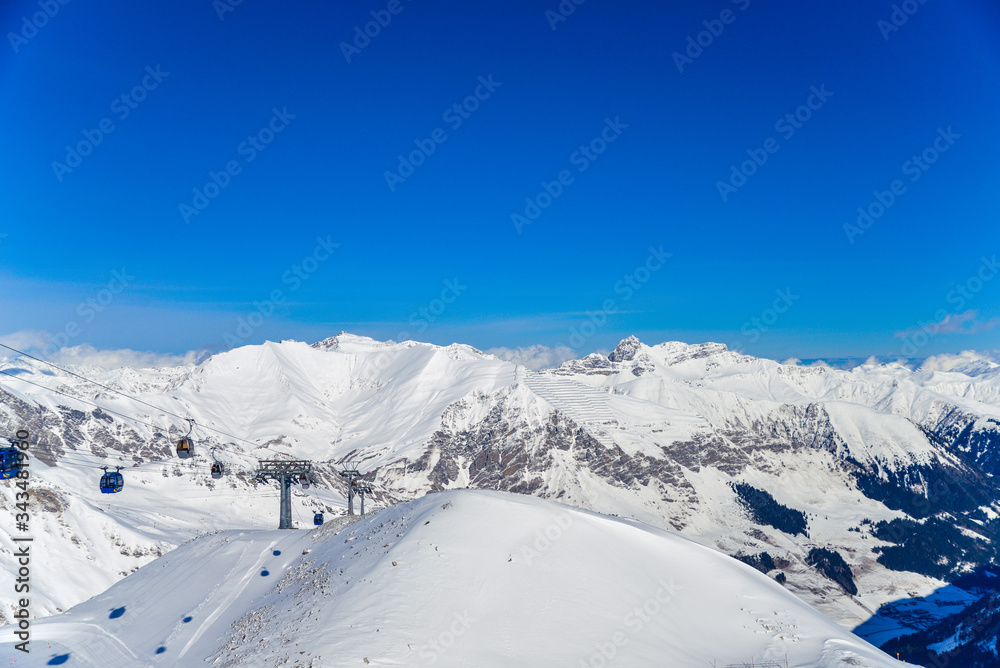 Ski lift to the top of the Austrian Alps in snowy mountains