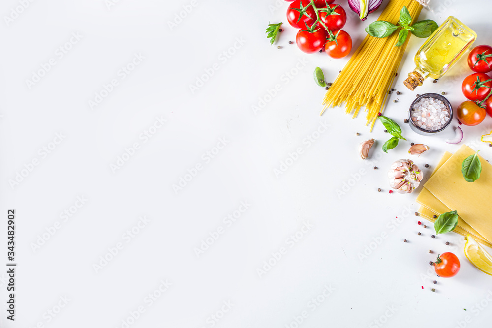 Italian food ingredients for cooking Spaghetti Pasta. Raw spaghetti pasta with various ingredient - onion, tomatoes, garlic, basil, parsley, cheese, olive oil. On white table background, flatlay copy Italian food ingredients for cooking Spaghetti Pasta. Raw spaghetti pasta with various ingredient - onion, tomatoes, garlic, basil, parsley, cheese, olive oil. On white table background, flatlay copy