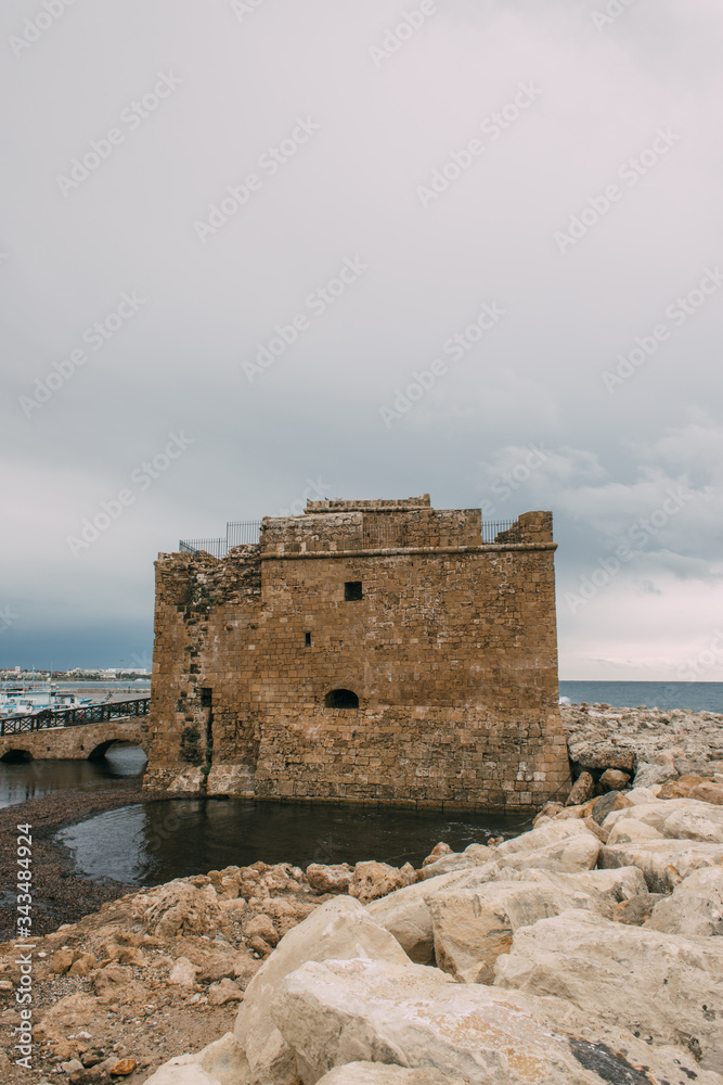 PAPHOS, CYPRUS - MARCH 31, 2020: ancient castle of paphos near mediterranean sea