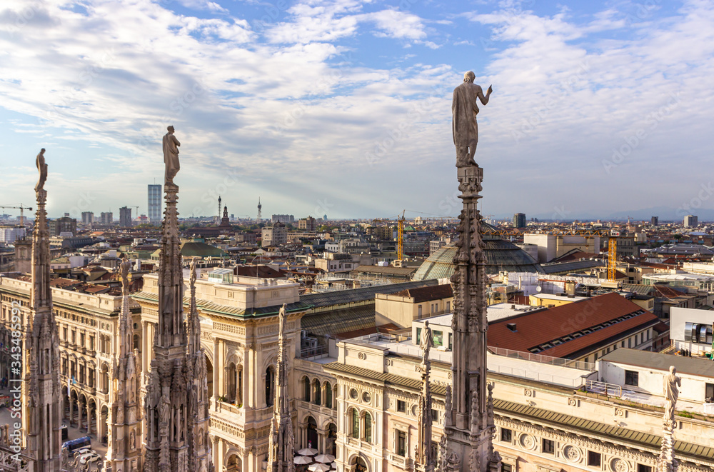 View from the decorated stone carvings of the Cathedral of Milan - Duomo di Milano roof in Milan city, Italy