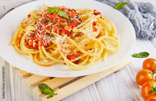 Tasty appetizing classic Italian spaghetti pasta with tomato sauce