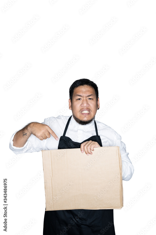 Bearded asian men waiter, chef dressed in black apron is holding cardboard in white background.The concept of protest, attention, request. Place for text or copy space. Clipping path. Bearded asian men waiter, chef dressed in black apron is holding cardboard in white background.The concept of protest, attention, request. Place for text or copy space. Clipping path.