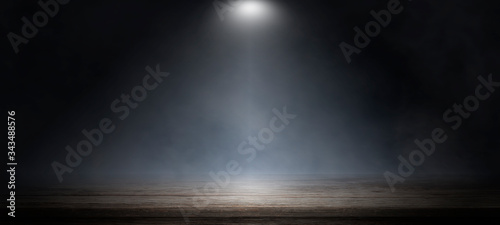 Empty wooden table with smoke float up on dark background, perspective wooden floor shelf table, used as a studio background wall to display your products.