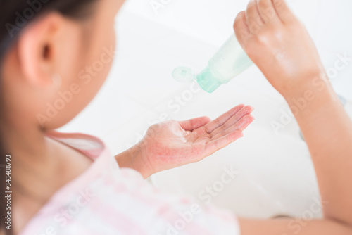 coronavirus pandemic prevention little asian girl is wash hands with soap warm water and rubbing nails and fingers washing frequently or using hand sanitizer gel. hygiene concept hand detail..