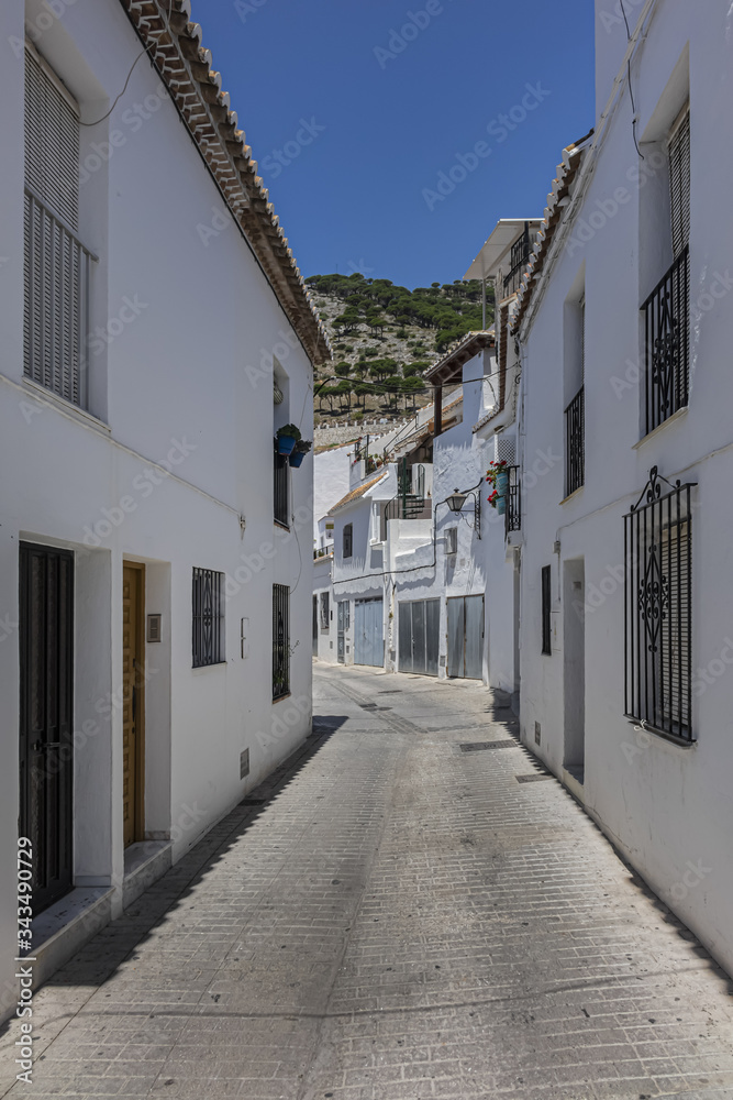 Beautiful view of Mijas Picturesque Narrow Street. Mijas - Spanish hill town overlooking the Costa del Sol, not far from Malaga. Mijas known for its whitewashed buildings. Mijas, Andalusia, Spain.