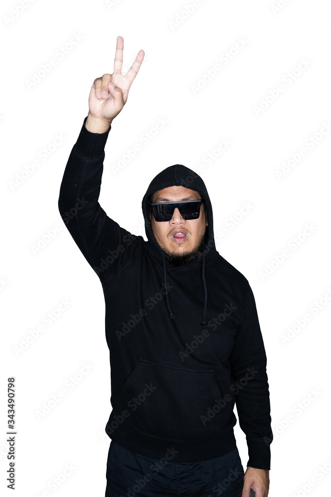 Bearded asian men dressed in black hoody is showing victory sign in white background.The concept of protest, attention, request. Place for text or copy space. Clipping path. Bearded asian men dressed in black hoody is showing victory sign in white background.The concept of protest, attention, request. Place for text or copy space. Clipping path.