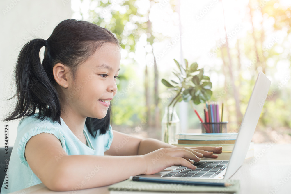 pretty stylish schoolgirl studying homework during online lesson at home, social distance during quarantine, self-isolation, online education concept, home school, study online video call teacher. pretty stylish schoolgirl studying homework during online lesson at home, social distance during quarantine, self-isolation, online education concept, home school, study online video call teacher.
