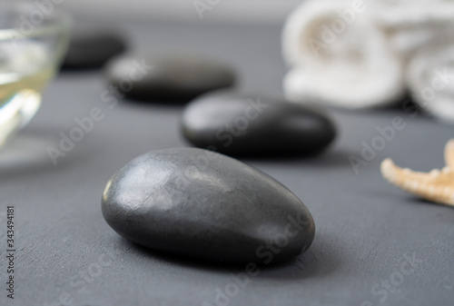 Set of Spa massage stones with seashells and starfish on a light background.  Concept of Spa rest and relaxation.