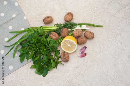 Healthy foods greens nuts lemon garlic . Food is proper nutrition. Vegetarian food