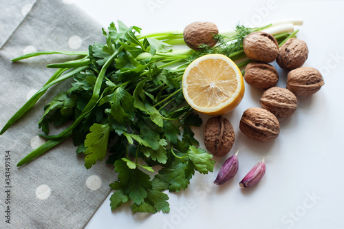 Healthy foods greens nuts lemon garlic . Food is proper nutrition. Vegetarian food