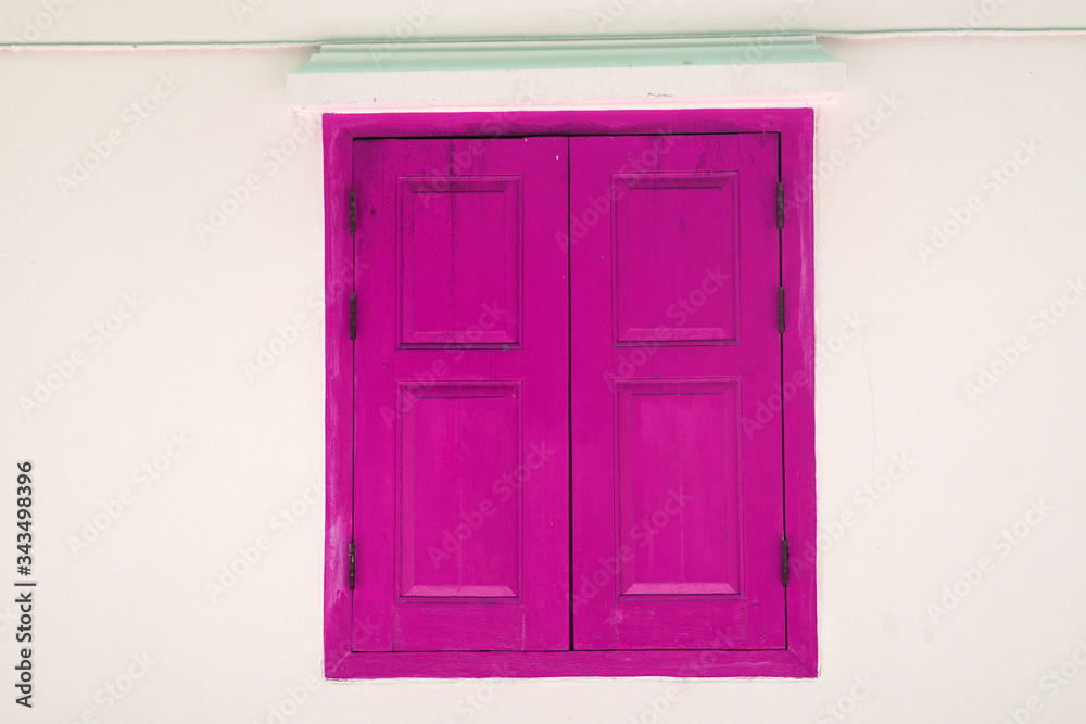 Violet Wooden door on white wall texture background - abstract surface with copy space                                
