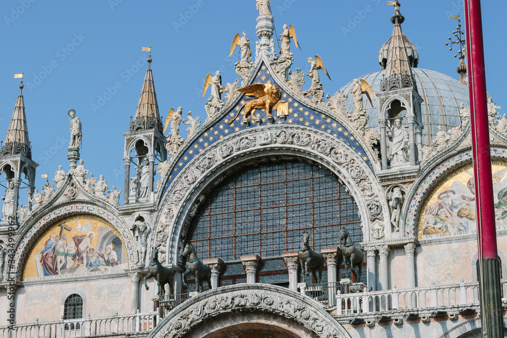  Basilica di San Marco. Roof in sunny day. Old church on ancient square. Streets of venice. Old area. Italian view. Roof in sunny day. Detail of famous St. Mark's Cathedral. Blue and golden decor.
