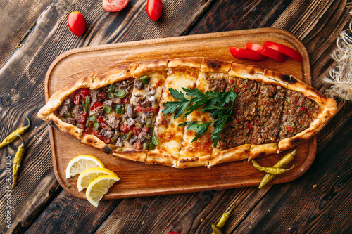 Pide turkish flat bread with ground meat photo