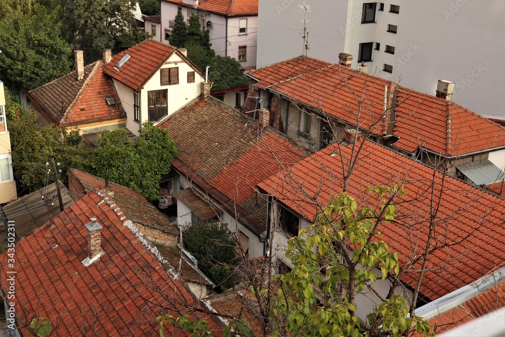 Red tiled roofs of houses.