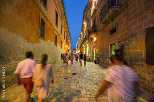 Night view of the alleys and squares of Menorca in Spain.