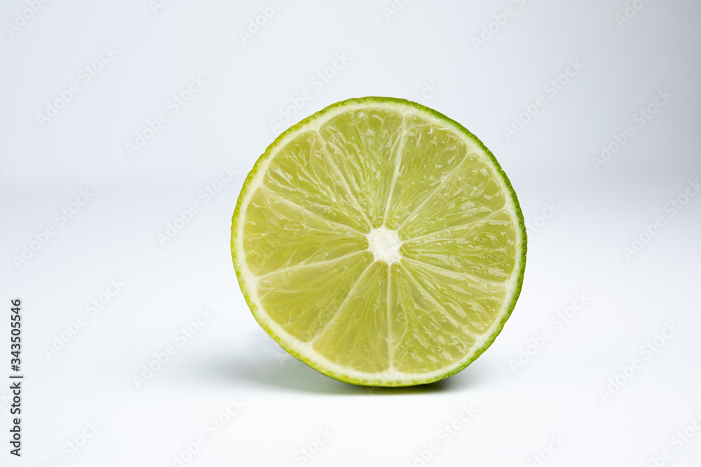 Cross-section of lime fruit isolated on a white background