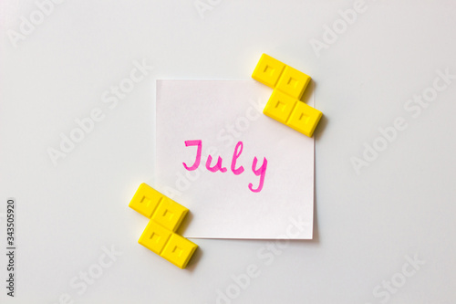 Sticky note on the white background. Business/education memo summer planning. Summer months motivation notes. July