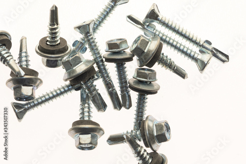 sheet metal and stainless steel screws together with hex nuts