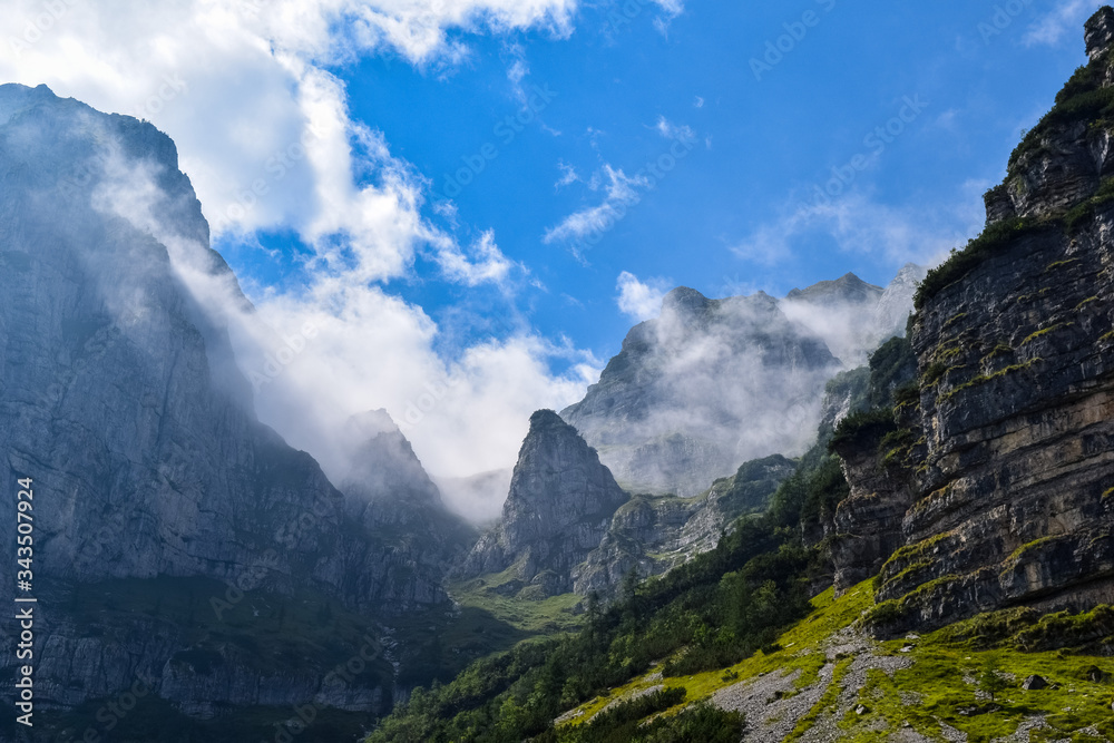 Clouds over the peaks of The Dolomites at the Brenta Adamello Mountains, Trentino, Italy