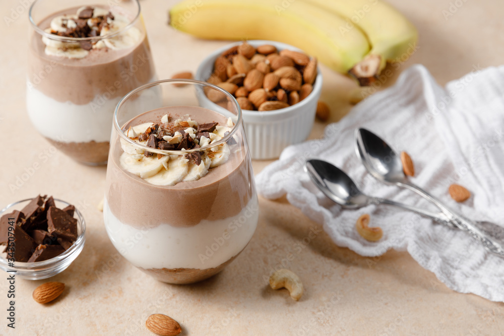 Chia seeds pudding with chocolate and banana smoothie in a glass Chia seeds pudding with chocolate and banana smoothie in a glass