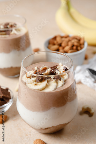 Chia seeds pudding with chocolate and banana smoothie in a glass