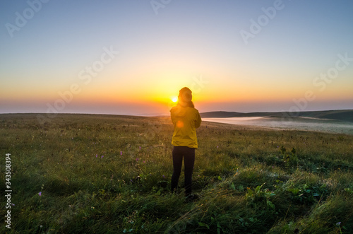 man walking on the beach at sunset © Губский Иван