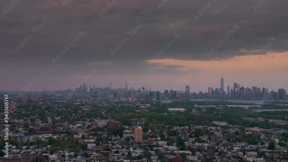twilight flight over New Jersey with New York City on the horizon twilight flight over New Jersey with New York City on the horizon