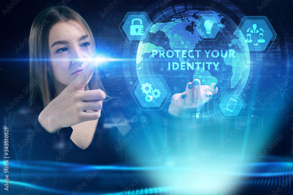 Business, Technology, Internet and network concept. Young businessman working on a virtual screen of the future and sees the inscription: Protect your identity Business, Technology, Internet and network concept. Young businessman working on a virtual screen of the future and sees the inscription: Protect your identity