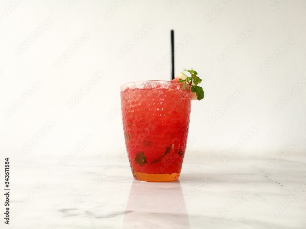 Drink scene of Ice Red soda Mix with passion fruit juice on Striped marble Table and white Texture background Drink scene of Ice Red soda Mix with passion fruit juice on Striped marble Table and white Texture background