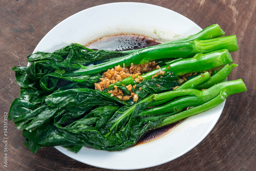 A plate of delicious garlic kale, Chinese Food A plate of delicious garlic kale, Chinese Food