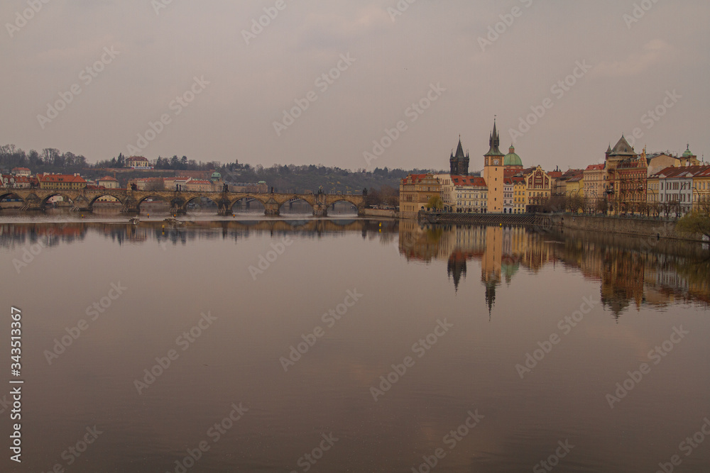 
view of the river and reflections in it. Old Prague architecture by the river Vltava. In the Czech Republic