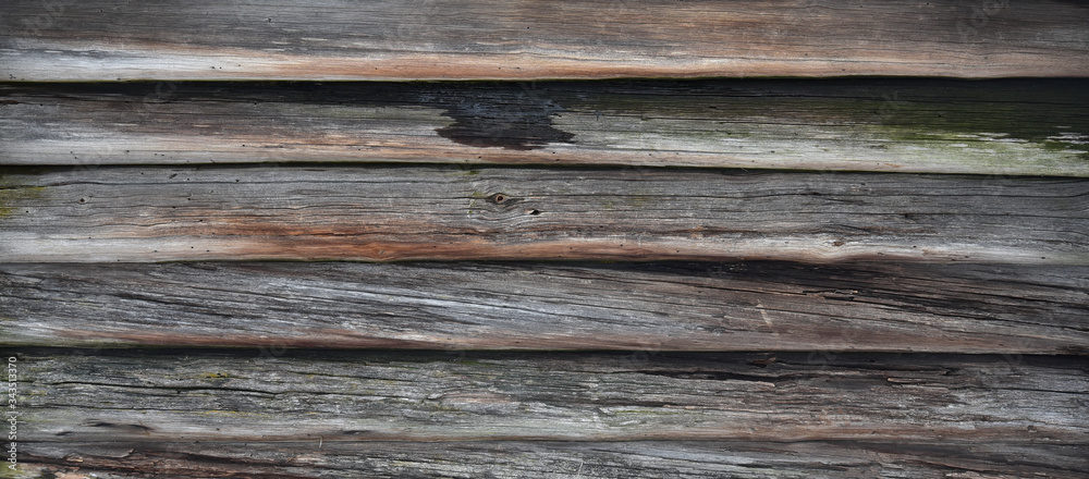 Brown old log wall. Wooden decrepit texture Brown old log wall. Wooden decrepit texture